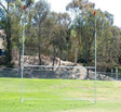 Portable rugby goal posts with flags assembled on a field