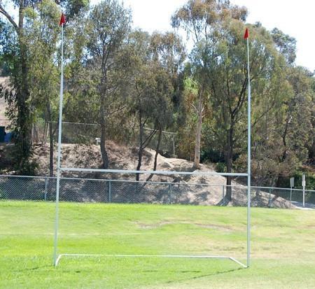 Portable rugby goal posts with flags assembled on a field