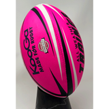 Ruggers Rugby Supply KooGa high-visibility pink training rugby ball with black and white accents on a stand